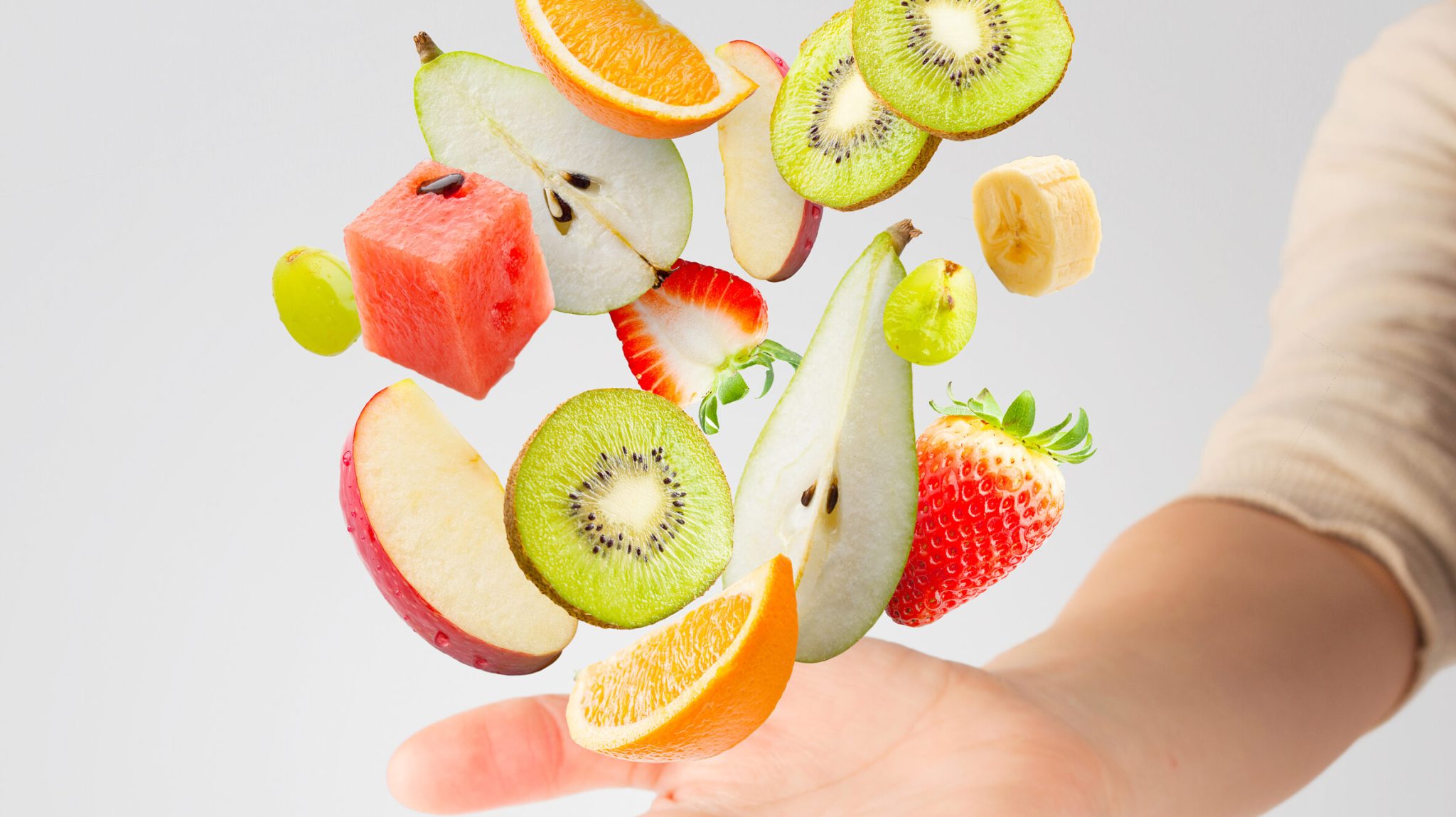 IV drip bag labelled "Reset & Recharge" surrounded by fresh fruits and relaxed individuals, representing wellness and energy restoration.